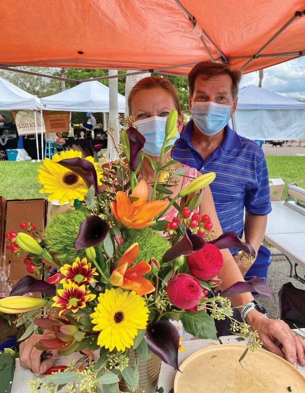 Happy Flowers vendors Anne and Jim Bellinder. ANNALEE HALL / WELLEN PARK JOURNAL